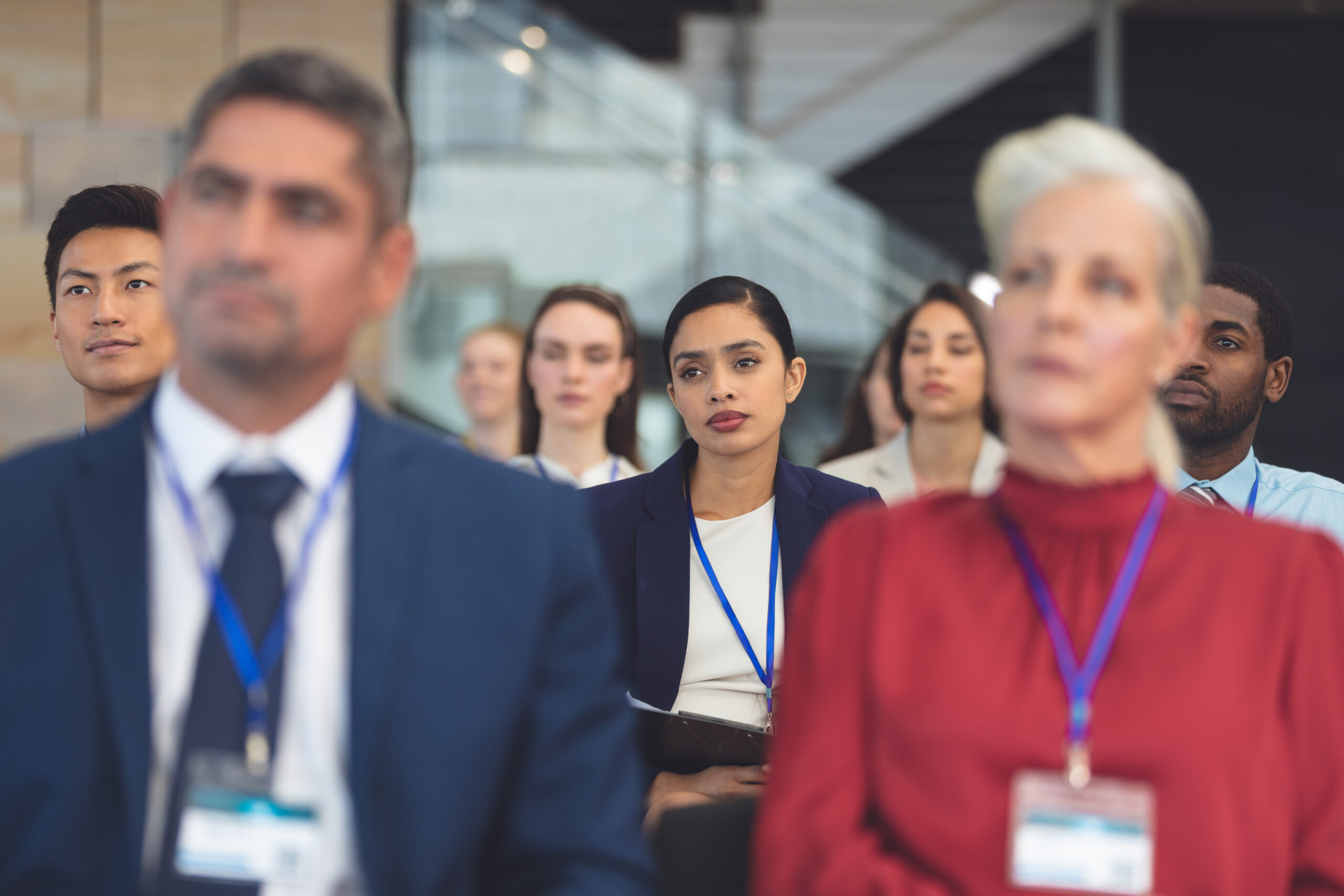 Front view of attentive mixed race young businesswoman in a business seminar in office